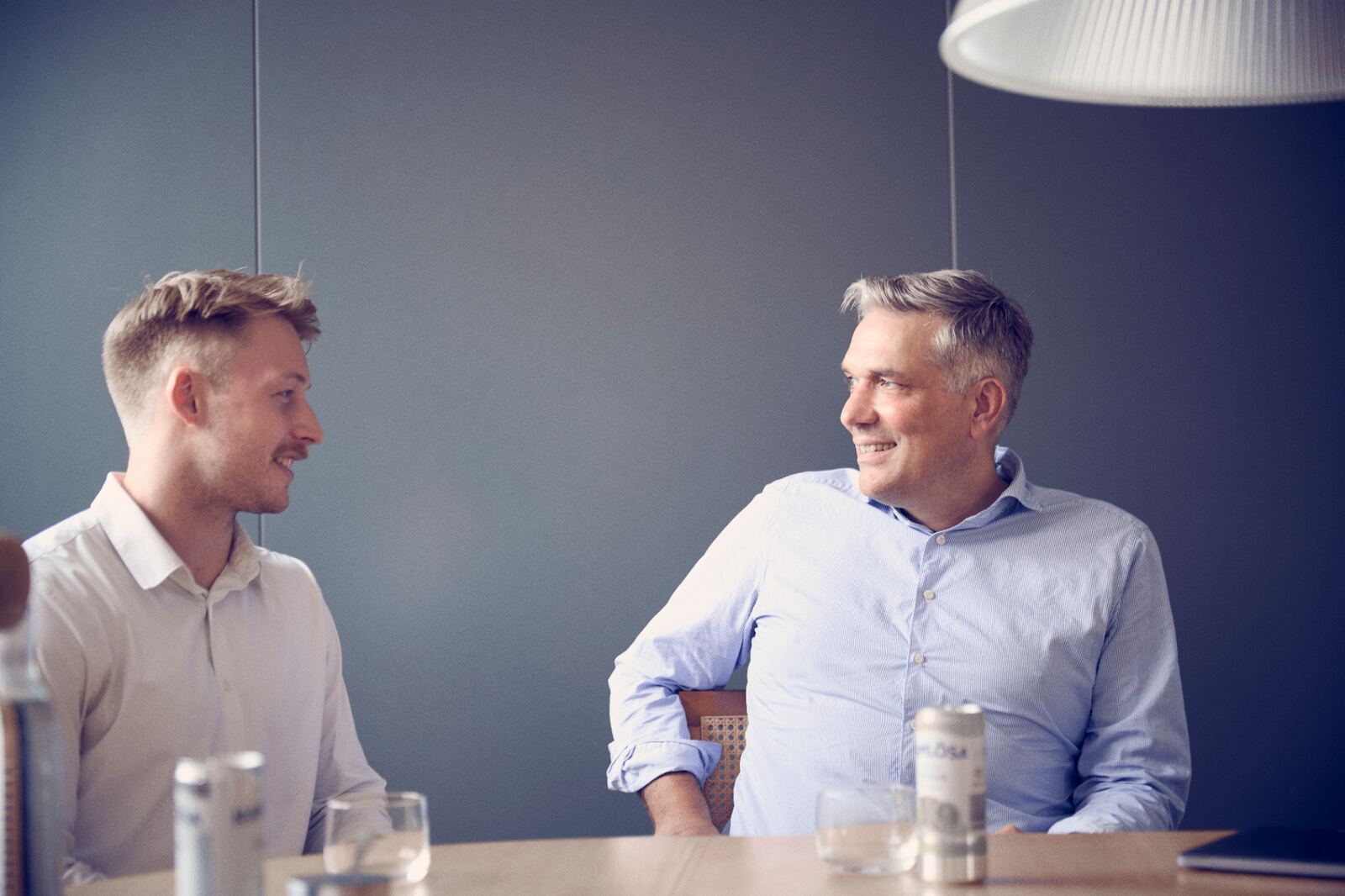 Two people in conversation in a modern office