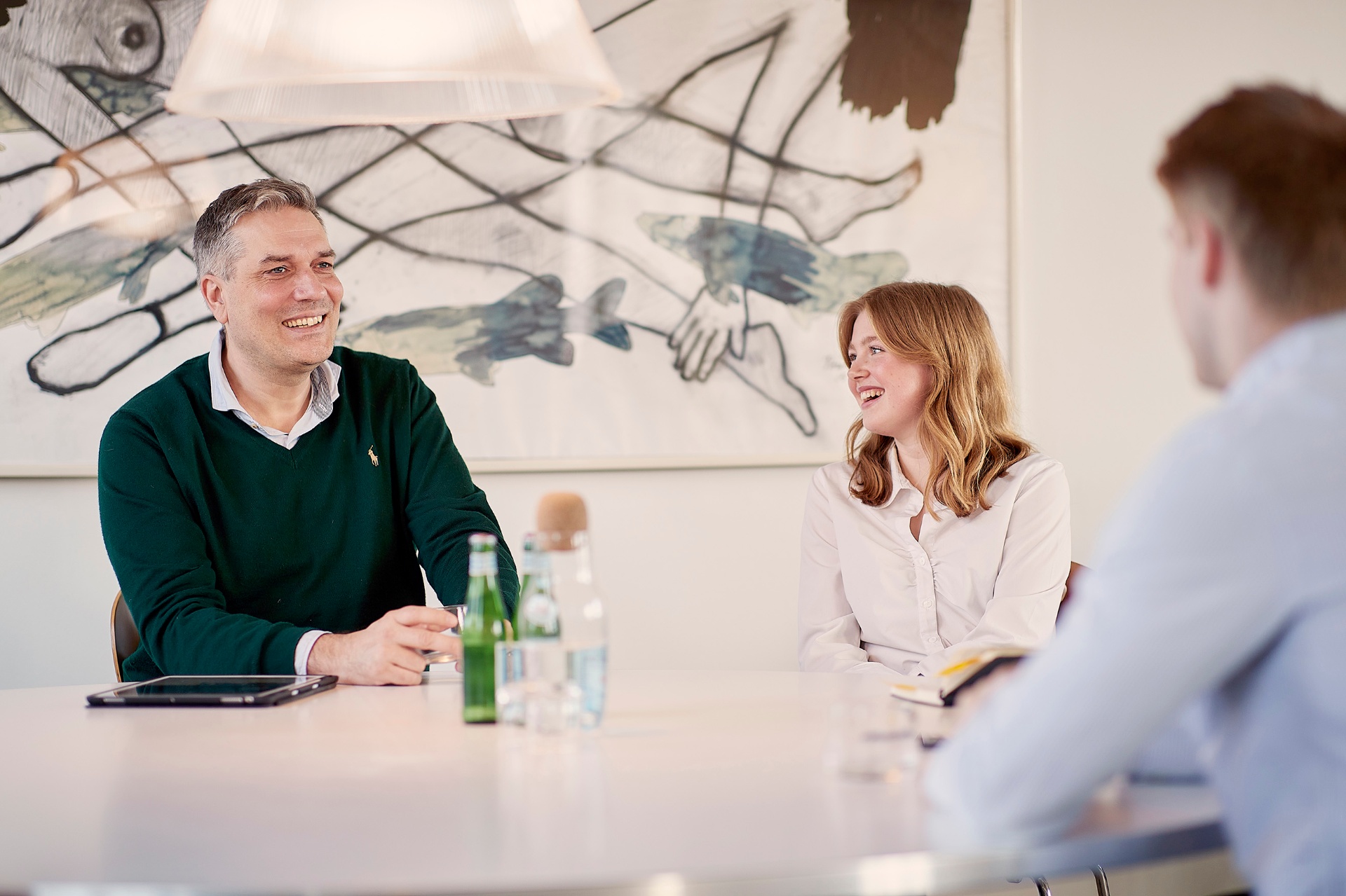 GlobeSearch consultants in conversation around the meeting table